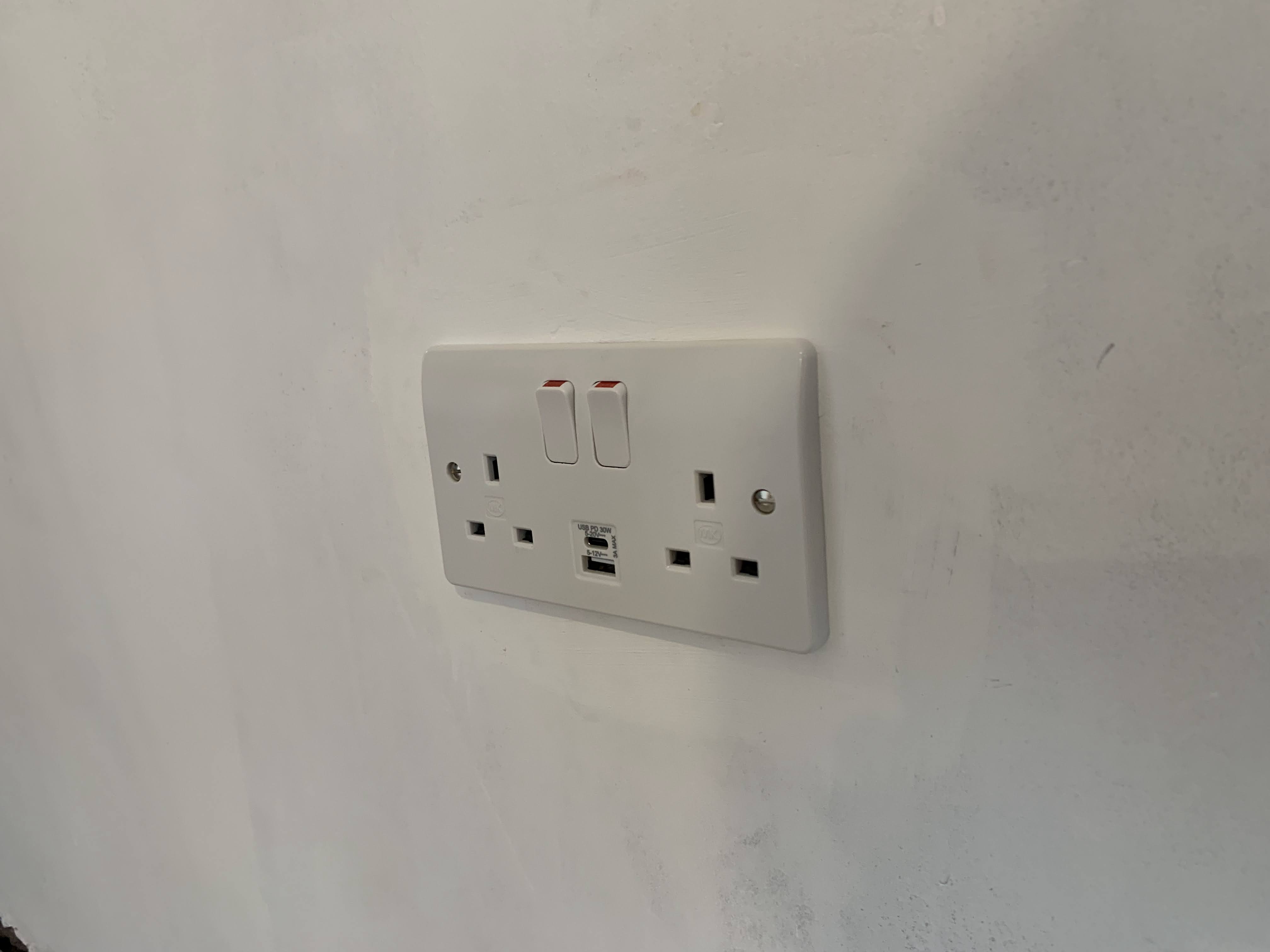 A new, modern metal consumer unit representing a safe electrical installation.